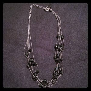 Silver necklace with black beads